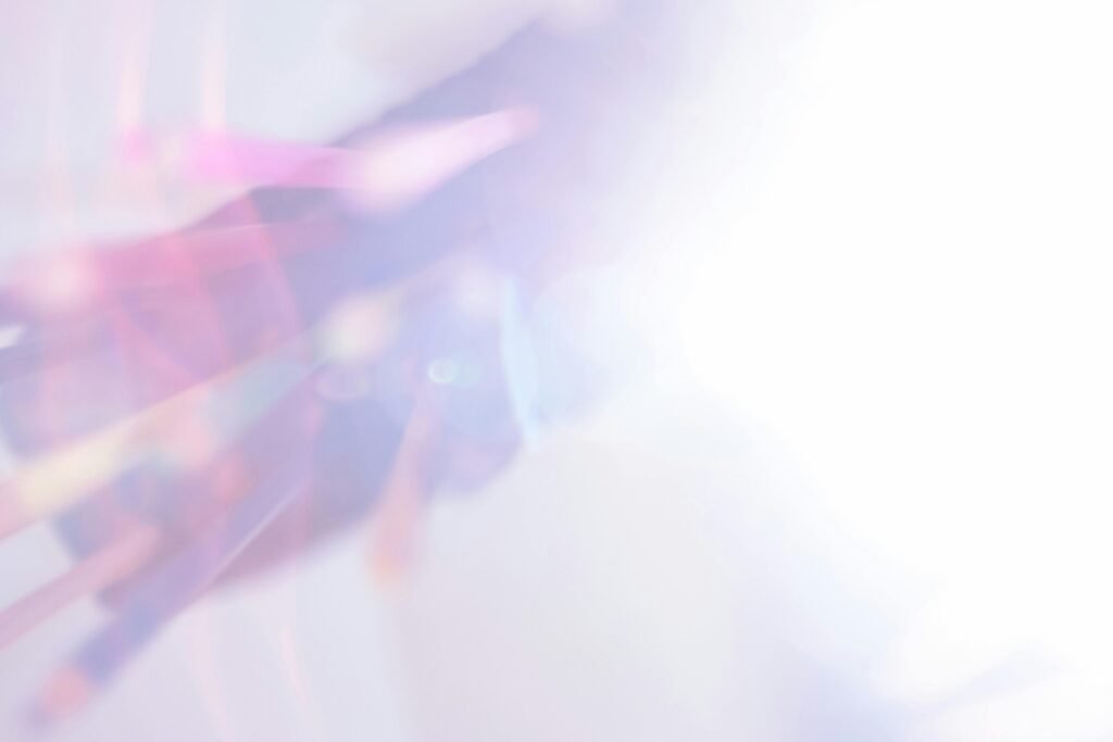 A vibrant abstract image with pastel colors and light effects creates a dreamy atmosphere.